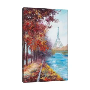 Billigare Canvastavla 70x100 cm - Vacker höstscen med Eiffeltornet i bakgrunden, omgiven av färgglada träd och en glittrande flod Röd / Blå / Orange - Inredning