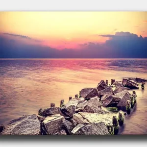Canvastavla 70x100 cm - Stillsam vy av en klippig strandlinje vid solnedgången Grå / Ljusblå / Rosa - Inredning Populär