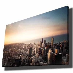 Köp online Canvastavla 70x100 cm - Panoramavy av en stad med höga skyskrapor och en solnedgång som skapar en dramatisk atmosfär Blå / Orange / Grå - Inredning
