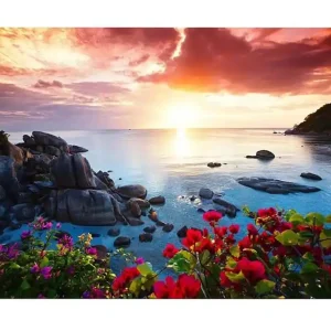 Begränsat antal Canvastavla - Vacker solnedgång över havet med blommor i förgrunden - Inredning & dekor