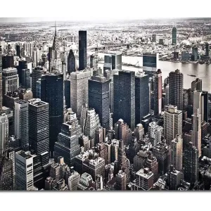 Canvastavla 70x100 cm - Panoramavy av en stad med höga skyskrapor och en livlig stadsbild Svart / Grå / Vit - Inredning Populärt val