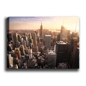 Rabatt Canvastavla 70x100 cm - Panoramavy av en stad med skyskrapor och den ikoniska Empire State Building i solnedgången Guld / Grå / Blå - Inredning